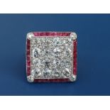 An Edwardian diamond & ruby set platinum panel ring, of square design, having four rows of old cut