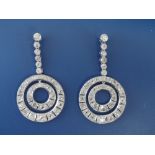 A pair of old cut diamond drop earrings, each ending in two concentric hoops, total diamond weight