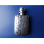 An Edwardian silver hip flask having overall honeycomb dimpled finish, London 1902, 5.8" high.