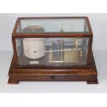 An oak cased barograph by Dolland, with chart drawer to base, 14" across overall - in working
