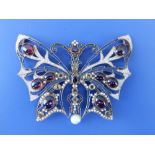 A large gilt metal butterfly brooch set with pearls, enamel & paste, of openwork form, retailed by