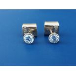 A pair of solitaire diamond collet set 18ct gold stud earrings, of total diamond weight