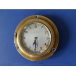 A circular brass cased 8 Day car clock with silvered dial - 'Patent +', 3.9" diameter . Reputed to