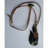 A Maori pounamu jade pendant in the form of a fish hook, 2".