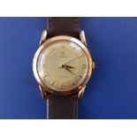 A gent's 9ct gold Cyma 'Cymaflex' wrist watch on replacement leather strap.