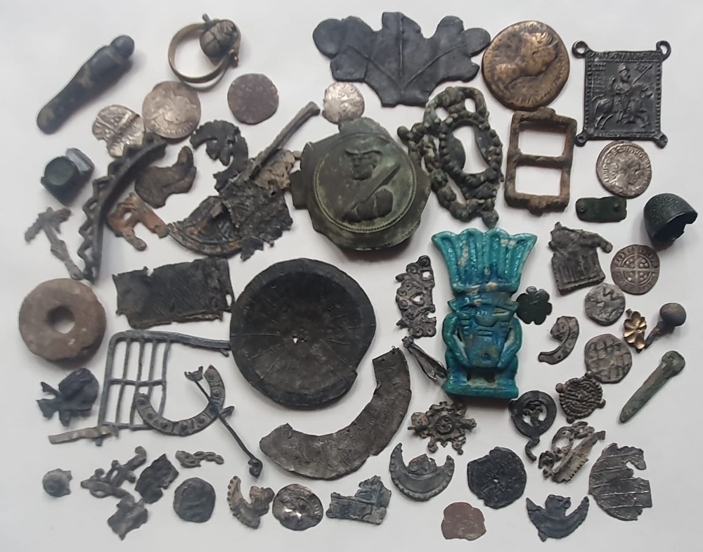 A collection of artefacts, Roman & hammered coins - many appear to have been excavated.