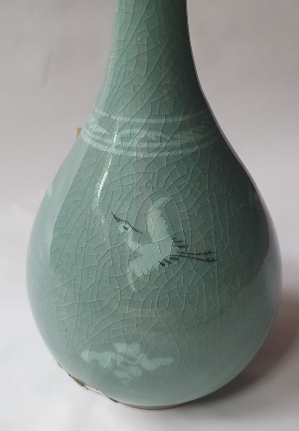 A Korean celadon glazed biottle vase decorated with a small crane & floral sprigs, 7.5" high. - Image 2 of 5