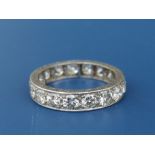 A diamond set white metal eternity ring, the 17 brilliant cut stones of total weight approximately 2