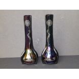 A pair of Loetz iridescent amethyst glass vases, decorated with art nouveau silver overlay depicting
