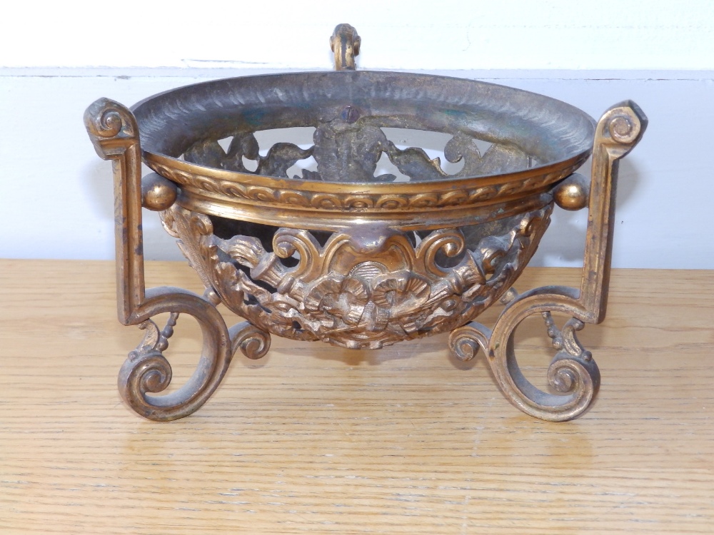 A gilt brass centrepiece frame, 7.3" diameter.