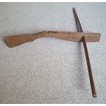A large wooden crossbow, both stock & bow of wooden construction, length of bow 42".