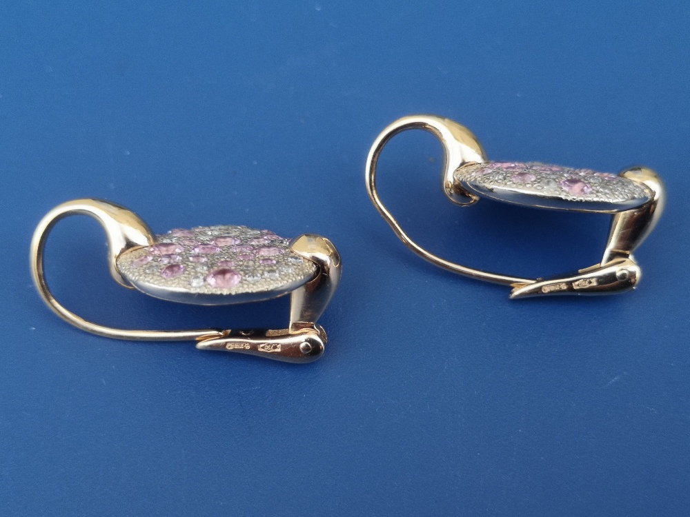 A pair of modern pink & white diamond set 18ct gold earrings, each formed as a disc pave set with - Image 2 of 3