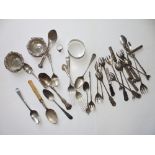 A collection of silver/white metal teaspoons, small forks & other items.