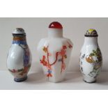 Two Chinese enamelled copper snuff bottles and a painted glass snuff bottle, the tallest 2.9". (3)