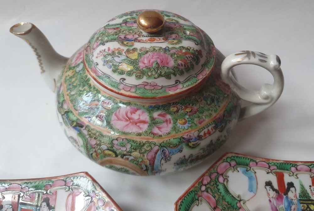 A Chinese famille rose Canton porcelain teapot and two plates, the teapot 9" high. (3) - Image 4 of 5