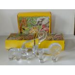 Three boxed Kosta Boda 'Zoo' glass flatback animals - Lion, Hippopotamus & Elephant, the largest, 6"