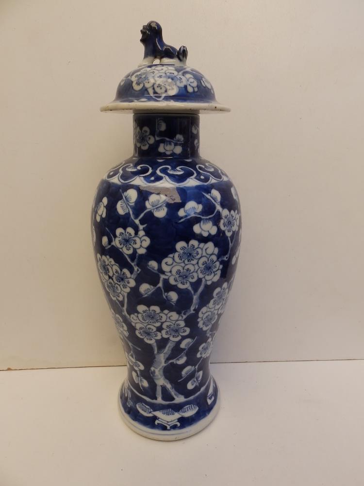 A 19thC Chinese blue & white porcelain covered vase of slender meiping shape, painted with a