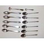 A set of six 830 standard silver coffee spoons with hoof terminals & seven others. (13)