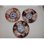Three Japanese Imari porcelain plates, approx. 8.5" diameter.