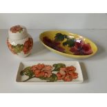 A Moorcroft yellow ground Hibiscus oval dish, 9" across, a white ground Hibiscus rectangular tray