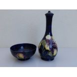 A Moorcroft leaf & berry pattern dark blue ground bowl, 6.25" diameter, together with a hibiscus