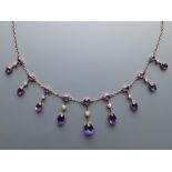 A late Victorian/Edwardian amethyst & pearl set gold fringe necklace, 17.5".