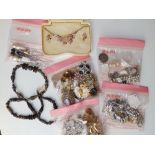 A quantity of beads & costume jewellery.