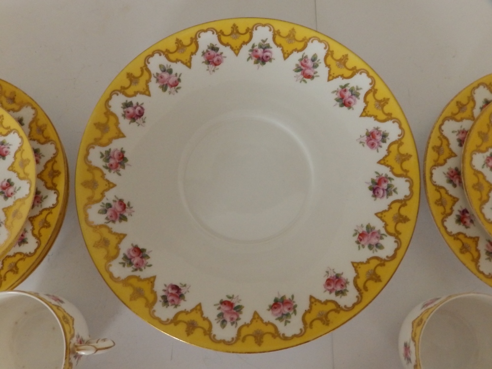 An early 20thC Royal Worcester 19 piece tea set, decorated roses with yellow & gold borders in - Image 2 of 20