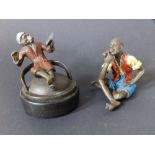 A cold-painted bronze figure of a young man smoking a pipe - 'Geschutzt', 2.5" and one other. (2)