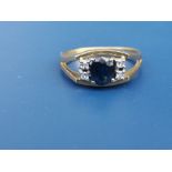 A modern sapphire & diamond set 18ct gold ring. Finger size M/N.