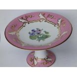 A Victorian porcelain pedestal cakestand painted flowers with pink & gold borders, 9.25"