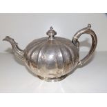 A Victorian lobed circular teapot, WM London 1858, 8.75" across handle - dents to body.