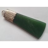 An antique New Zealand pounamu jade axe-head shape pendant with yellow metal mount, 1.9".