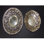 Two matching Dutch silver openwork oval stands, decorated birds & flower scroll, the larger 8"