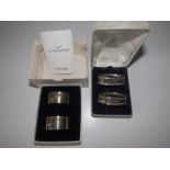 A boxed pair of British Airways Concorde silver napkin rings and one other boxed pair of modern