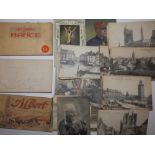 A booklet of WWI postcards depicting Albert (Somme), series 14, two other postcard booklets
