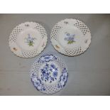 A pair of 19thC German porcelain ribbon plates with floral painted decoration, Meissen reject marks,