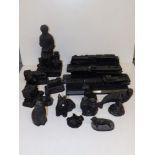 A collection of modern ornaments made using British coal, including model locomotives.