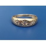 A gypsy set diamond 18ct gold band ring. Finger size O.