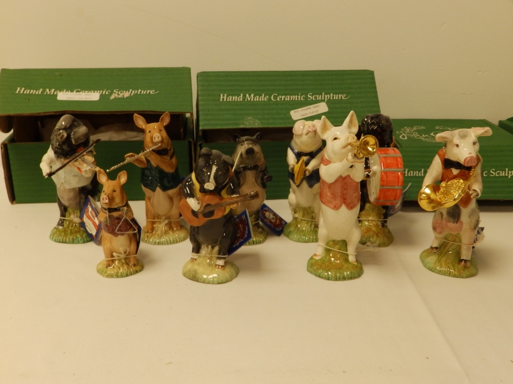 A nine piece Beswick Pig Band in original boxes.