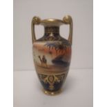 A Noritake vase painted with a camel in desert scene, 11" high.