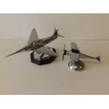 An art deco chrome plated jet fighter lighter, 9" across and a monoplane turboprop lighter. (2)