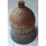 A large two piece wooden form of bell shape, 19" high.