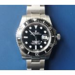 A gent's stainless steel Rolex Oyster Perpetual Submariner Date automatic wrist watch Model 11661OLN