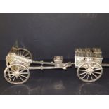 A detailed silver scale model of a WWI period gun carriage with limber, having numerous working