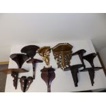 12 antique wooden wall brackets.