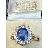 A certified natural colour change 4 carat Sri-Lankan sapphire & diamond oval cluster ring on