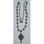 An antique Austro-Hungarian silver-gilt pendant necklace, inset with pearls and green/pale stones, a