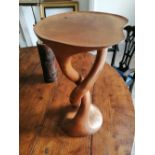A modern carved wood occasional table, possibly by David Savage, of twisted organic form, 25"