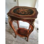 A gilt metal mounted reproduction two tier occasional table, 35" high, 19" across.